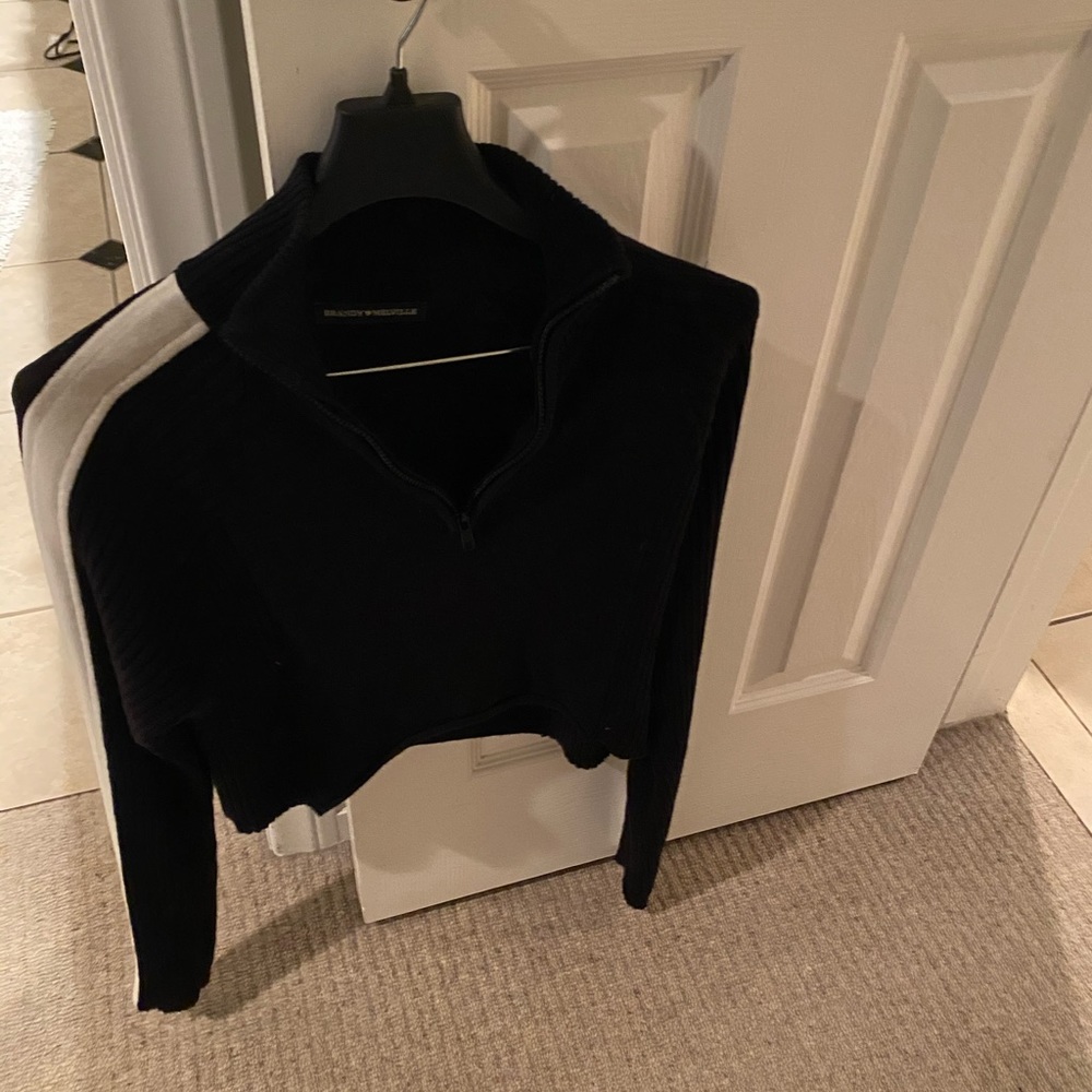Black sweater with white stripe